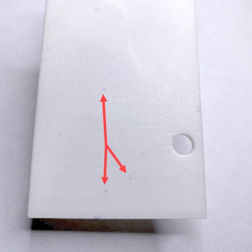 Example of speckling on a white part